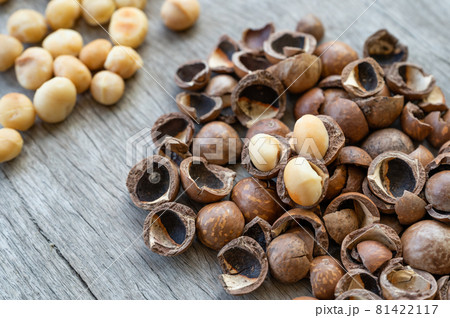 Pile of peeled Macadamia nuts on wooden table Pile of peeled Macadamia nuts on wooden table 81422117