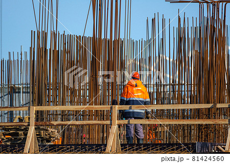 Unrecognizable contractors near metal construction 81424560