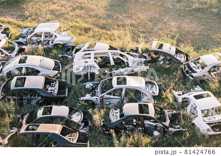 Car dump. Broken old rusty cars lying on the grass Car dump. Broken old rusty cars lying on the grass 81424766