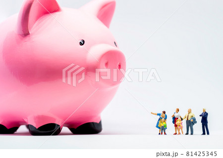 Miniature people. Two adults showing giant piggy bank to a boy Miniature people. Two adults showing giant piggy bank to a boy 81425345