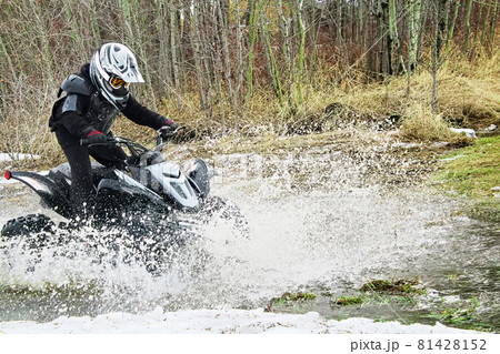 Child quading through water in spring 81428152