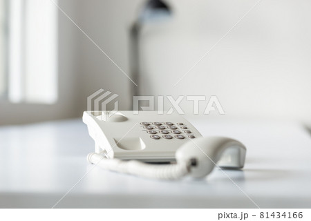White landline telephone with handset off line White landline telephone with handset off line 81434166