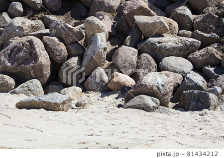 Rockfall on the road in the mountains. Stones of different sizes. Landslides. Rockfall on the road in the mountains. Stones of different sizes. Landslides. 81434212
