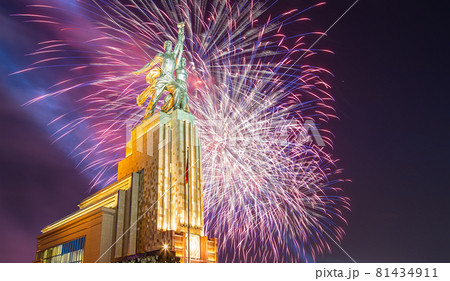 Celebratory colorful fireworks and soviet monument Rabochiy i Kolkhoznitsa ( Worker and Kolkhoz Woman or Worker and Collective Farmer) of sculptor Vera Mukhina, Moscow, Russia. Made of in 1937 81434911