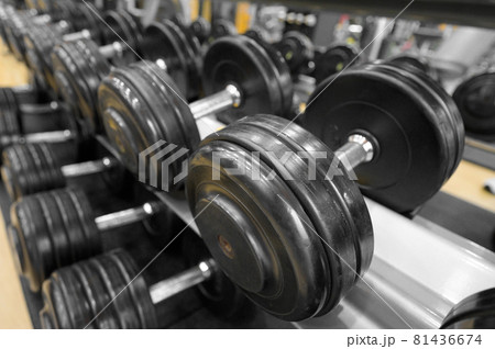 Close up of dumbbells. Gym interior. Close up of dumbbells. Gym interior. 81436674