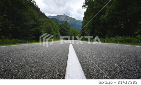Empty asphalt road and mountain landscape Empty asphalt road and mountain landscape 81437585