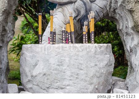 NEW TAIPEI CITY, TAIWAN - JANUARY 27, 2012:  Incense sticks burning inside the pot at Guan Dao Guan Ying Buddhist Temple 81451123