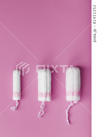 Cotton tampons on a pink background with a free space 81451352