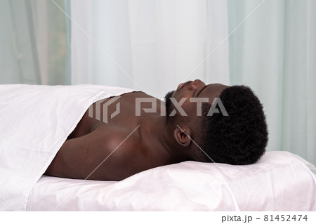 african man lying on a couch in a health facility african man lying on a couch in a health facility 81452474