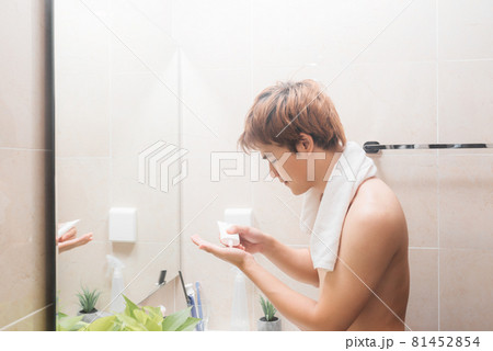 Men taking care of skin, morning face wash routine for cleaning acne pimples. 81452854