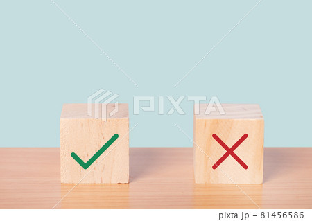 True and false symbols accepted rejected on wood cubes. True and false symbols accepted rejected on wood cubes. 81456586