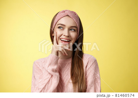 Girl having great idea, smirking delighted, proud herself, touching cheek smiling amused creating plan in mind looking at upper left corner pleased, intrigued and excited seeing awesome opportunity Girl having great idea, smirking delighted, proud herself, touching cheek smiling amused creating plan in mind looking at upper left corner pleased, intrigued and excited seeing awesome opportunity 81460574