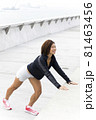 Close-up of attractive happy female athlete stretching 81463456