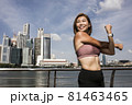 Close-up of attractive happy female athlete stretching 81463465