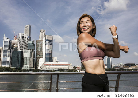Close-up of attractive happy female athlete stretching Close-up of attractive happy female athlete stretching 81463465