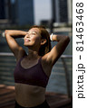 Close-up of attractive happy female athlete stretching 81463468