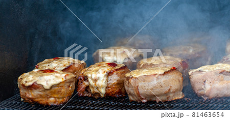 Cooking meatballs covered with bacon on the grill Cooking meatballs covered with bacon on the grill 81463654