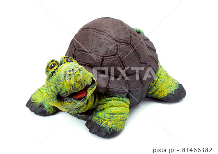 Concrete garden figure painted with colored paints, landscape object in the form of a cheerful turtle with a brown shell and a green head isolated on a white background. Concrete garden figure painted with colored paints, landscape object in the form of a cheerful turtle with a brown shell and a green head isolated on a white background. 81466382