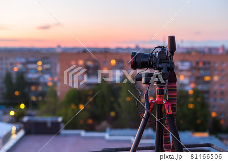 pro dslr on tripod in evening roof photoshoot 81466506