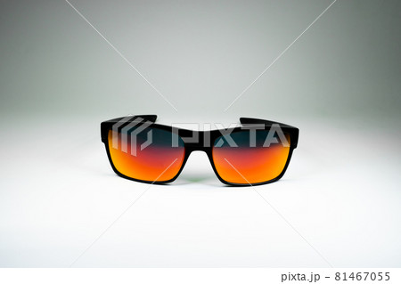 Product photo of sun Glasses with orange glass and black frame on white background. Template for social media, website Product photo of sun Glasses with orange glass and black frame on white background. Template for social media, website 81467055