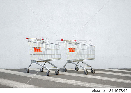 Two empty grocery cart shopping online store concept. Empty trolley cart market store wall background sale design. Supermarket cart ecommerce shop. Double benefits concept shopping trolley supermarket Two empty grocery cart shopping online store concept. Empty trolley cart market store wall background sale design. Supermarket cart ecommerce shop. Double benefits concept shopping trolley supermarket 81467342