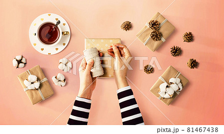 Person making present boxes 81467438