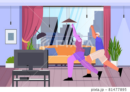 senior man woman couple doing fitness exercises watching tutorials on tv online training healthy lifestyle active old age 81477895