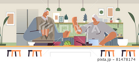 happy senior couple preparing healthy food at home grandparents cooking together old age concept 81478174