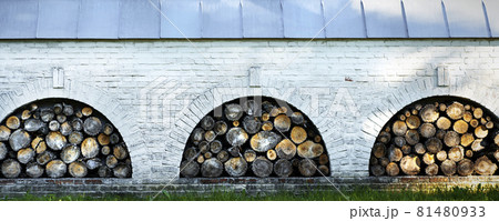 Firewoods storage place under the roof. Decorative elements. Firewood background Firewoods storage place under the roof. Decorative elements. Firewood background 81480933