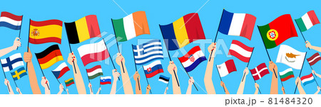 Close up of hands rising up 27 European Union member countries flags on blue background Close up of hands rising up 27 European Union member countries flags on blue background 81484320