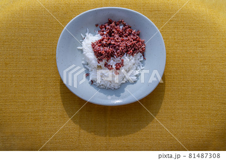 Riceberry and Jasmine rice in white plate. Healthy food and diet concept. Riceberry and Jasmine rice in white plate. Healthy food and diet concept. 81487308