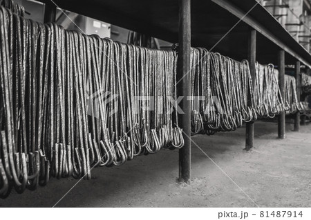 Metal hooks steel equipment in the reinforcement workshop manufacturing at an industrial enterprise Metal hooks steel equipment in the reinforcement workshop manufacturing at an industrial enterprise 81487914