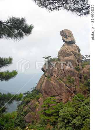 Sanqingshan Mountain in Jiangxi Province, China. View of Goddess Peak, a rocky outcrop on Mount Sanqing representing a woman looking to the distance. Sanqingshan is a Taoist mountain with lush forests Sanqingshan Mountain in Jiangxi Province, China. View of Goddess Peak, a rocky outcrop on Mount Sanqing representing a woman looking to the distance. Sanqingshan is a Taoist mountain with lush forests 81490839