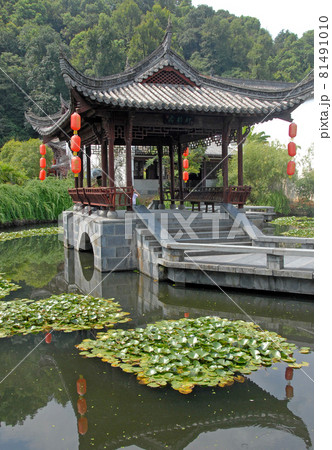 Jiangwan in Wuyuan County, Jiangxi Province, China. Jiangwan is an ancient town in Wuyuan County known for its Tang Dynasty architecture. Pavilion with red lanterns in a lotus pond. Jiangwan in Wuyuan County, Jiangxi Province, China. Jiangwan is an ancient town in Wuyuan County known for its Tang Dynasty architecture. Pavilion with red lanterns in a lotus pond. 81491010