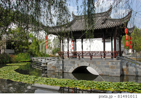 Jiangwan in Wuyuan County, Jiangxi Province, China. Jiangwan is an ancient town in Wuyuan County known for its Tang Dynasty architecture. Pavilion with red lanterns in a lotus pond. Jiangwan in Wuyuan County, Jiangxi Province, China. Jiangwan is an ancient town in Wuyuan County known for its Tang Dynasty architecture. Pavilion with red lanterns in a lotus pond. 81491011