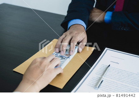 Government officials hand receiving bribe money from businessman, the concept of corruption and anti-bribery 81491442