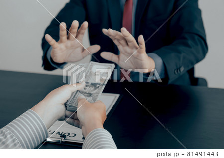 Businessman hand give the bribe to government officials who raise the hand refusing money 81491443