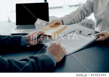 Government officials hand sign the contract and receiving bribe money from businessman, the concept of corruption and anti-bribery 81491444