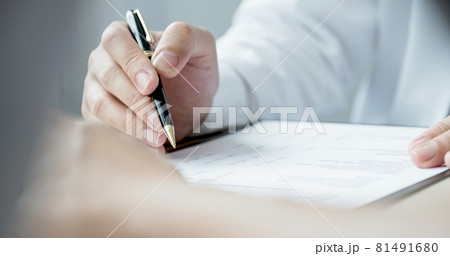 The doctor hand write report and explained the health examination results to the patient, medical checkup concept The doctor hand write report and explained the health examination results to the patient, medical checkup concept 81491680
