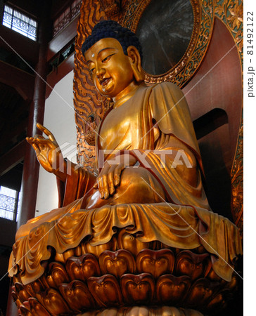 Hangzhou, Zhejiang Province, China: Lingyin Temple also known as the Temple of the Soul's Retreat in Hangzhou, China. Statue of Buddha in the Maravira Hall (main hall) at the temple. 81492122
