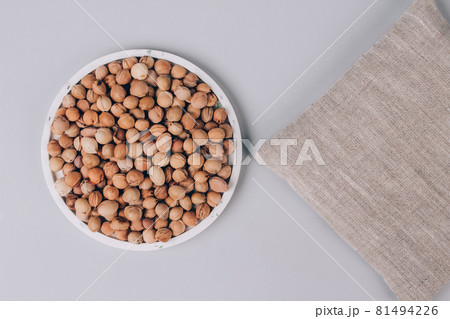 Cherry stone pillow, cherry pit filled pillow for spa massage - natural heat or cool pack. Alternative medicine and therapy, pit sack for chiropractic care and autistic kids. Copy space and mockup 81494226