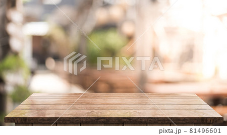 Empty wooden table top with lights bokeh on blur restaurant background	 81496601