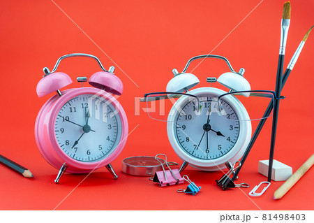 Concept Education or business Alarm clock and teacher glasses Business objects isolated on colorful background Back to school concept 81498403