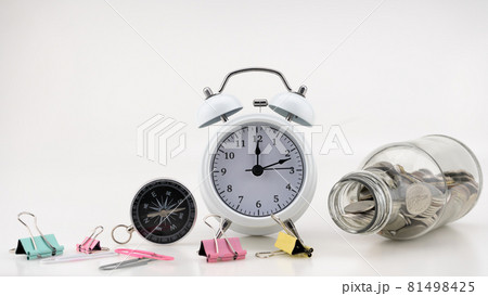Concept Business finance and Shopping sale Coins in jar with White alarm clock Business objects isolated on white background 81498425