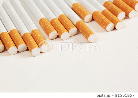 image of several commercially made pile cigarette on white  background. or Non smoking campaign concept, tobacco pattern top view. 81501957