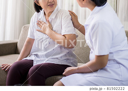 Elderly asian woman having chest pain suffering from heart attack,Nurse take care and support Elderly asian woman having chest pain suffering from heart attack,Nurse take care and support 81502222