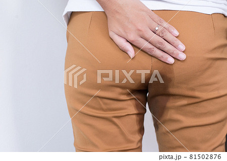 Hands woman holding her bottoms,Female need to pee,Urinary stain incontinence,Copy space for text on white background 81502876