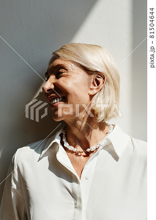 Elegant Mature Woman in Sunlight Elegant Mature Woman in Sunlight 81504644