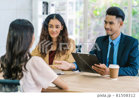 Senior Asian Manager explaining or answering about job description and benefits to Young Asian woman graduate with positive motion in meeting room,Business Hiring new member concept Senior Asian Manager explaining or answering about job description and benefits to Young Asian woman graduate with positive motion in meeting room,Business Hiring new member concept 81508312