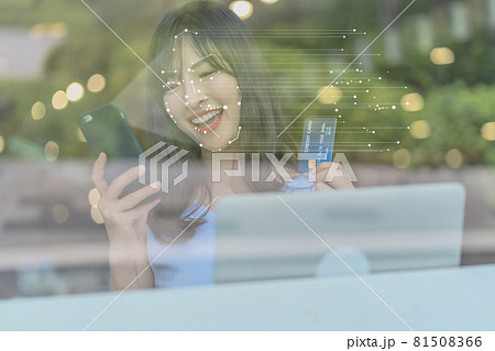 Asian woman using face recognition via smart mobile phone indoors, Biometric Verification and artificial intelligence, online shopping and payment online concept 81508366
